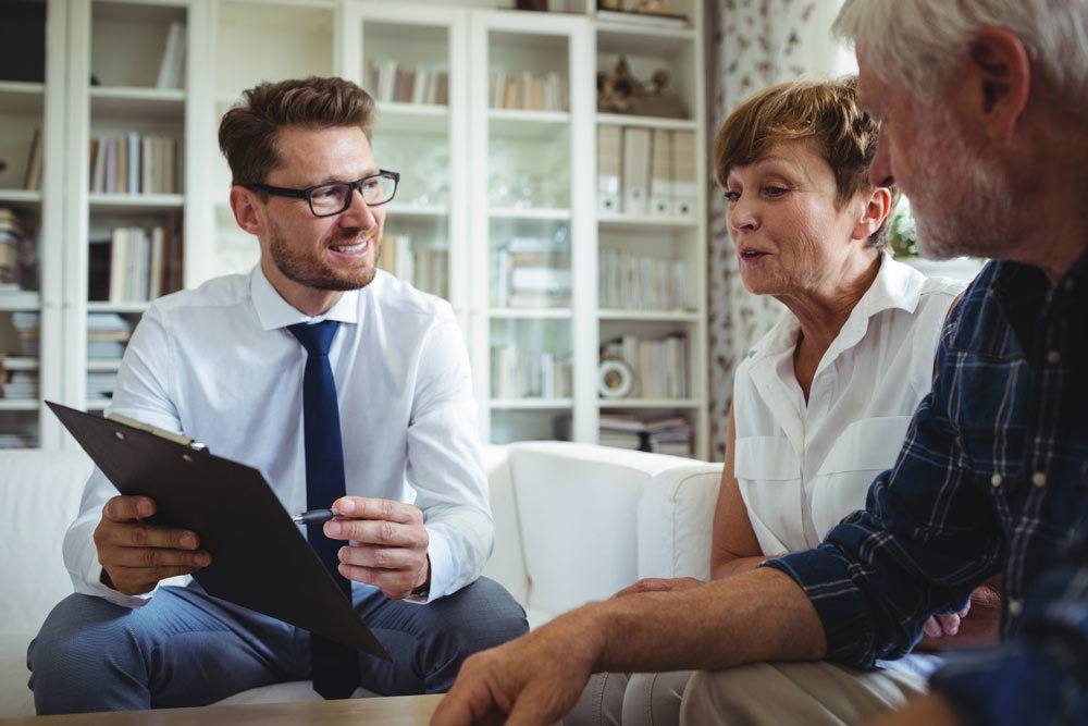 Senior couple talking to insurance agent